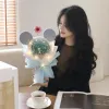 A luminous Micron-shaped bouquet with a white hand-held gift bag for creative birthday gifts details Picture